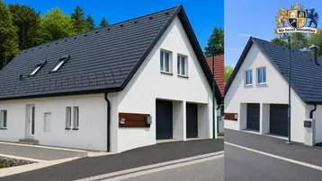 Modernes Einfamilienhaus mit weißer Fassade, dunklem Satteldach und integrierter Doppelgarage.
