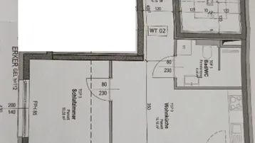 Grundriss einer Wohnung mit Schlafzimmer, Wohnküche und Bad/WC, inklusive Treppenhauszugang.