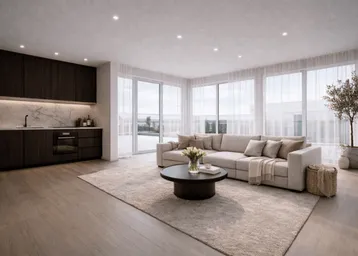 Modernes, offenes Wohnzimmer mit integrierter Küche, großen Fenstern und hellem Interieur.
