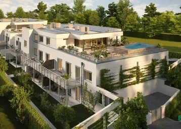 Moderne Wohnanlage mit mehreren Einheiten, Dachterrassen und begrünten Außenbereichen.