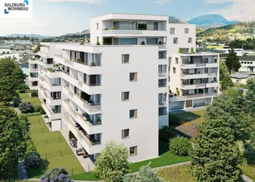 Moderne Wohngebäude mit Balkonen und Terrassen, umgeben von Grünflächen und Bergblick.