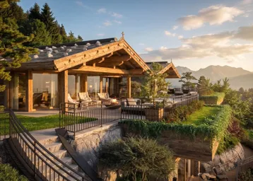 Luxuriöses Chalet mit mehreren Terrassen, gemütlichen Sitzbereichen und atemberaubendem Bergblick bei Sonnenuntergang.