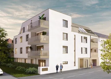 Ansicht des modernen Mehrfamilienhauses von der Straße aus mit klarer Architektur und großen Fenstern.