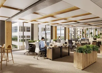 Modernes Großraumbüro mit ergonomischen Arbeitsplätzen, großen Fenstern und viel Tageslicht.