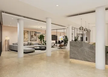 Elegante Lobby mit Empfangsbereich, bequemen Sitzgelegenheiten und modernen Säulen in einem Bürogebäude.