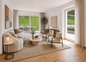 Gemütliches Wohnzimmer mit Sofa, Sesseln, Holzboden und direktem Gartenzugang.