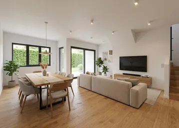 Helles, offenes Wohn- und Esszimmer mit Holzboden, Zugang zum Garten und moderner Einrichtung.