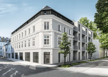Eckgebäude mit einer Kombination aus klassischer und moderner Architektur in städtischer Umgebung.