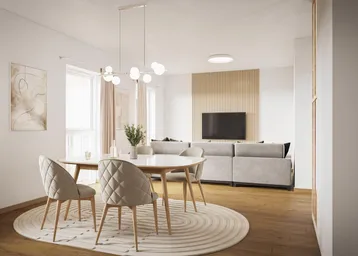 Moderner offener Wohn- und Essbereich mit Holzboden, bequemer Couch und stilvollem Esstisch.