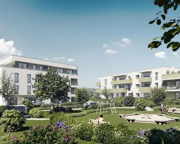 Moderne Wohngebäude mit großzügigen Balkonen und einer gepflegten Grünanlage inklusive Spielplatz.