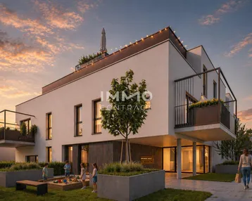 Moderne Wohnanlage bei Sonnenuntergang mit Balkonen, Dachterrasse und Spielbereich im Garten.