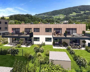 Moderne Reihenhäuser mit Holzfassaden, privaten Gärten und Balkonen in grüner Umgebung mit Bergblick.