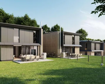 Moderne Reihenhäuser mit Flachdach, großen Terrassen und weitläufigem Gartenbereich.