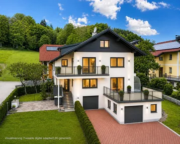 Modernes Einfamilienhaus mit weißer Fassade, großzügiger Terrasse, Balkonen und Doppelgarage, umgeben von grüner Natur.