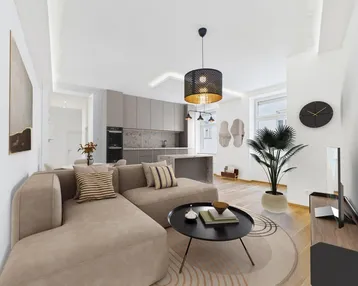 Moderner offener Wohnbereich mit integrierter Küche, beigem Sofa und stilvoller Einrichtung.