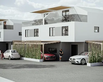 Moderne Reihenhäuser mit Flachdach und Carports in einer Wohnsiedlung.