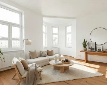 Helles Wohnzimmer mit großen Fenstern, Erker und modernem Interieur, ideal für Entspannung.
