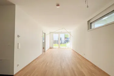 Stilvoller Erstbezug mit Garten, Garagenplatz und Gemeinschaftsdachterrasse
