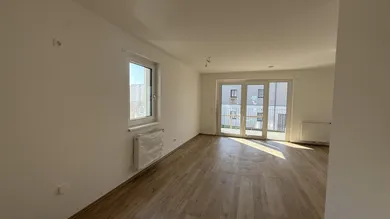 Haus_1_Top_5_Küche_mit_Blick_auf_Wohnbereich