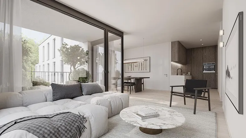 Heller, offener Wohn- und Essbereich mit moderner Einrichtung und Zugang zum Balkon.