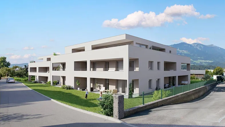 Moderne Wohnanlage mit klarer Architektur und Balkonen, eingebettet in eine grüne Landschaft mit Bergblick.
