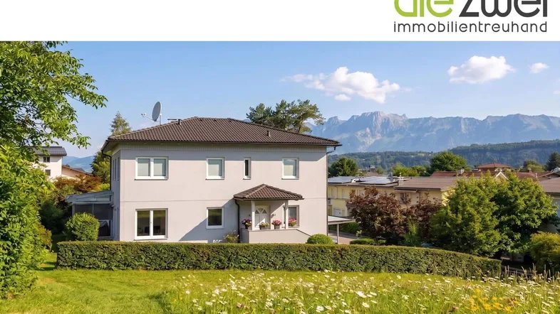 Helles Einfamilienhaus mit gepflegtem Garten und Bergblick in sonniger Lage.