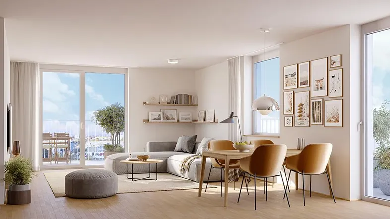 Heller, offener Wohn-Essbereich mit modernem Design, Parkettboden und Zugang zum Balkon.