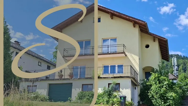 Mehrfamilienhaus mit Balkonen und Garage in ländlicher Umgebung unter blauem Himmel.