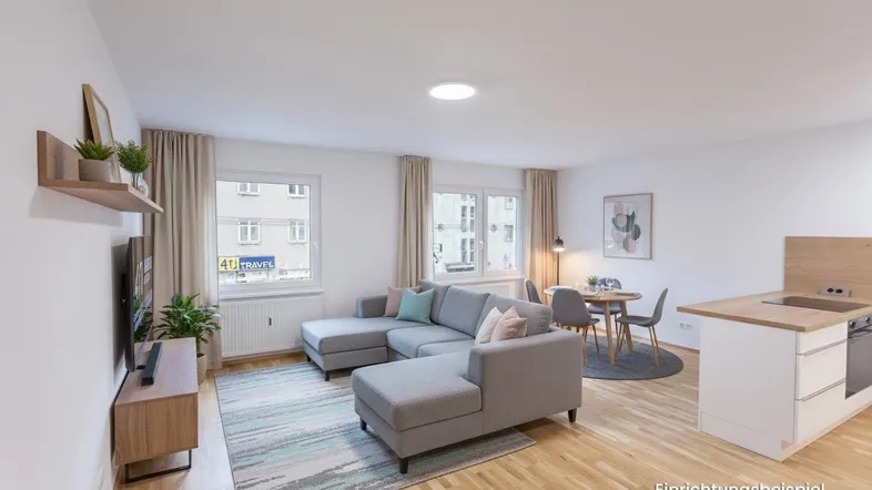 Helles Wohn- und Esszimmer mit offener Küche, modernem Sofa und Esstisch, als Einrichtungsbeispiel dargestellt.