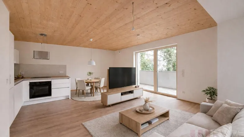 Helles, offenes Wohnzimmer mit integrierter Küche, Essbereich und Zugang zum Balkon, ausgestattet mit modernen Möbeln.
