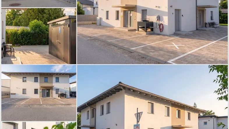 Modernes Mehrfamilienhaus mit gepflegter Fassade, Parkplätzen und Grünflächen im Außenbereich.