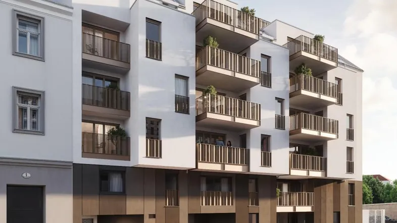Moderne Wohnanlage mit mehreren Balkonen und Tiefgaragenzufahrt in städtischer Umgebung.
