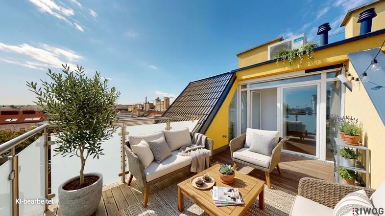 Geräumige Dachterrasse mit bequemen Loungemöbeln und weitem Blick über die Stadt.