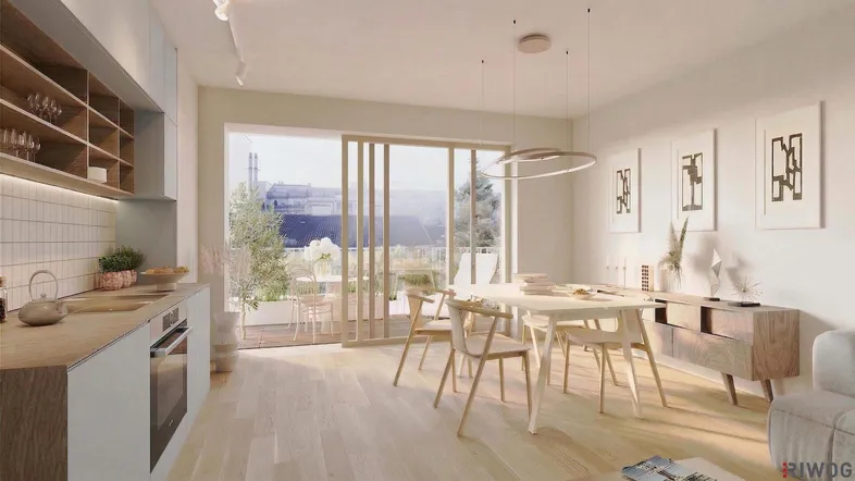 Heller offener Wohn- und Essbereich mit moderner Küche und Zugang zu einem Balkon.