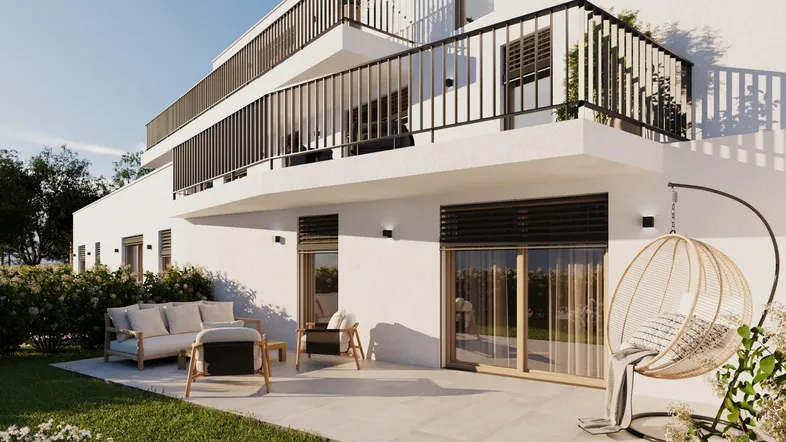 Moderne Wohnanlage mit großzügiger Terrasse und Gartenbereich, ideal für entspannte Stunden im Freien.