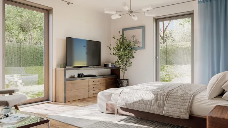 Helles Schlafzimmer mit großem Bett, TV-Möbel und direktem Zugang zum Gartenbereich.