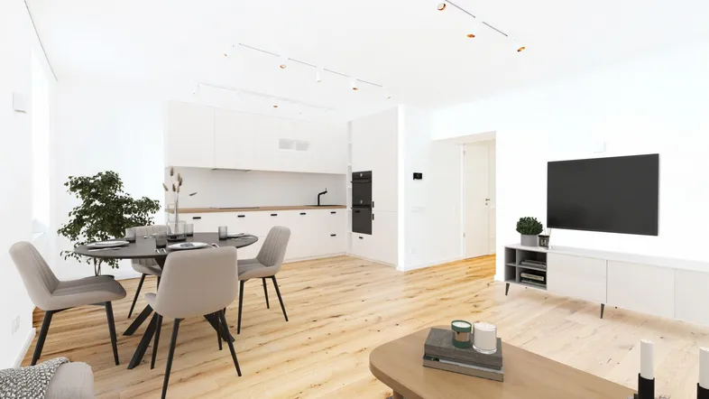 Heller, offener Wohn-Essbereich mit moderner Einbauküche und Holzboden, ideal für geselliges Beisammensein.