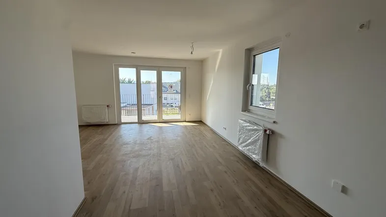 Haus_1_Top_12_Küche_mit_Blick_auf_Wohnbereich