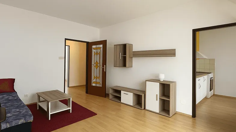 Helles Wohnzimmer mit Parkettboden, moderner Einrichtung und Zugang zu anderen Räumen.