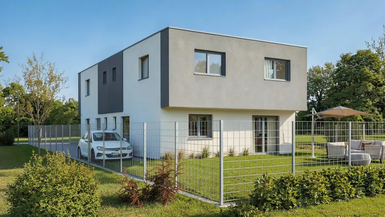 Modernes Einfamilienhaus mit gepflegtem Garten und gemütlicher Außenterrasse für entspannte Stunden.