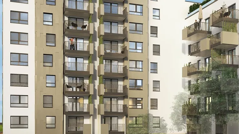 Moderne Wohnanlage mit hellen Fassaden, Balkonen und begrünten Außenbereichen.