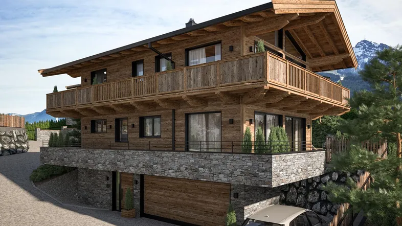 Modernes Chalet mit Holzfassade, Steinverkleidung und integrierter Garage in alpiner Umgebung.