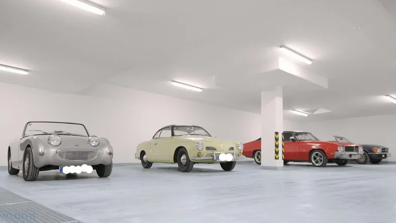Geräumige Tiefgarage mit mehreren Oldtimern und heller Beleuchtung, ideal für Sammlerfahrzeuge.