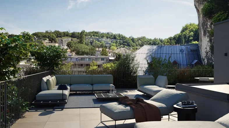 Geräumige Dachterrasse mit modernen Lounge-Möbeln und weitem Blick ins Grüne.