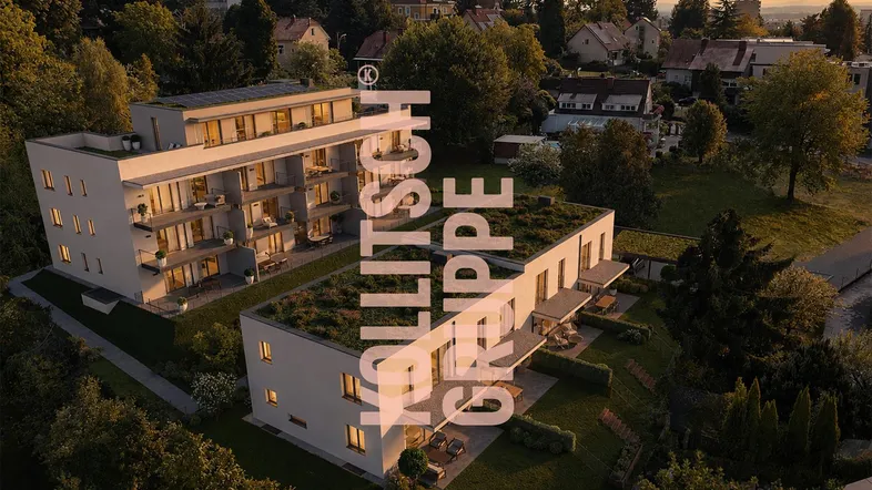 Moderne Wohngebäude mit Gründächern, Balkonen und Terrassen in einer grünen, von Bäumen umgebenen Umgebung.
