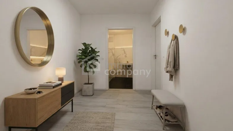 Moderner Eingangsbereich mit heller Einrichtung, Spiegel und Zugang zu einem Badezimmer.