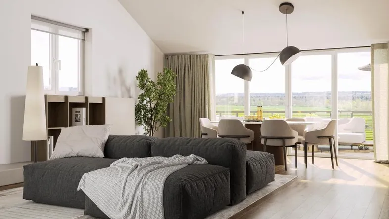Lichtdurchfluteter Wohnbereich mit gemütlichem Sofa, Essbereich und Zugang zu einem Balkon.