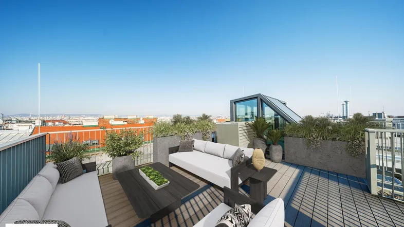 Geräumige Dachterrasse mit modernen Loungemöbeln, Pflanzen und weitem Stadtblick unter blauem Himmel.