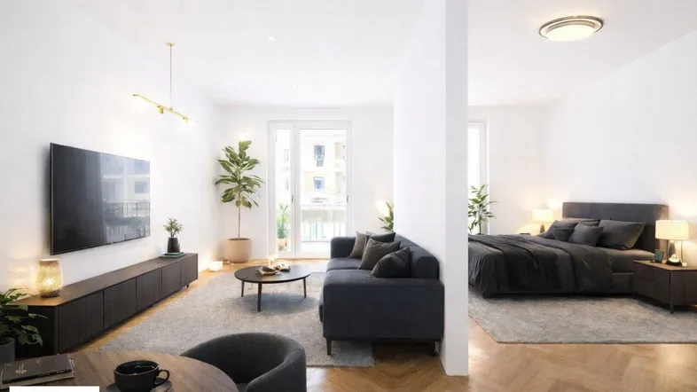Helles, offenes Wohnzimmer mit Parkettboden und angrenzendem Schlafbereich in modernem Stil.