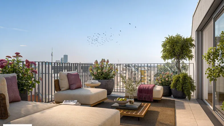 Geräumige Dachterrasse mit bequemen Loungemöbeln und weitem Blick über die Stadt.